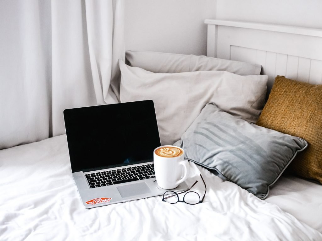 Laptop on cushion | Laptop on bed could block it vents and fan could make loud noise.